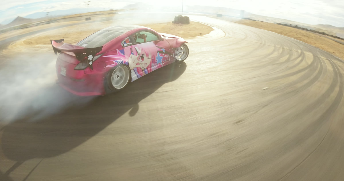 FPV side chase of a pink drift car at full angle